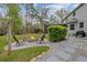 Inviting backyard features a fire pit surrounded by chairs, perfect for outdoor gathering at 27625 Lincoln Pl, Wesley Chapel, FL 33544