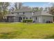Expansive backyard features a fire pit area and screened-in pool, perfect for outdoor enjoyment at 27625 Lincoln Pl, Wesley Chapel, FL 33544