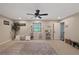 Cozy bedroom with ceiling fan, window, and neutral décor creating a relaxing atmosphere at 27625 Lincoln Pl, Wesley Chapel, FL 33544
