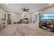 Open bonus room with a desk and a television creating a versatile space at 27625 Lincoln Pl, Wesley Chapel, FL 33544