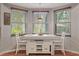 Bright dining area featuring large windows and comfortable seating at 27625 Lincoln Pl, Wesley Chapel, FL 33544