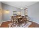 Elegant dining room featuring a wooden table with seating for six, a chandelier, and neutral wall color at 27625 Lincoln Pl, Wesley Chapel, FL 33544
