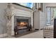 Close up on a beautifully crafted fireplace in a bedroom, with stone accents and elegant decor at 27625 Lincoln Pl, Wesley Chapel, FL 33544