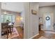 Foyer leading to dining area features hardwood floors, neutral walls and natural light at 27625 Lincoln Pl, Wesley Chapel, FL 33544