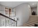 Grand foyer with staircase and a decorative compass creating an eye-catching focal point at 27625 Lincoln Pl, Wesley Chapel, FL 33544