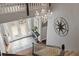 Elegant foyer with a chandelier and a compass decoration creating a welcoming ambiance at 27625 Lincoln Pl, Wesley Chapel, FL 33544