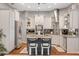 Modern kitchen with stainless steel appliances, granite countertops, and island seating at 27625 Lincoln Pl, Wesley Chapel, FL 33544