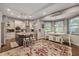 Well-equipped kitchen with stainless appliances, island seating, and an adjacent dining area at 27625 Lincoln Pl, Wesley Chapel, FL 33544