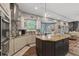Modern kitchen featuring stainless steel appliances and an island at 27625 Lincoln Pl, Wesley Chapel, FL 33544
