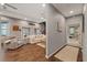 Open-concept living room with spiral staircase and hardwood floors at 27625 Lincoln Pl, Wesley Chapel, FL 33544