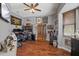 Comfortable home office featuring hardwood floors, ample workspace, and stylish decor at 27625 Lincoln Pl, Wesley Chapel, FL 33544