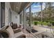 Inviting covered patio with comfortable seating, providing an ideal space for relaxation and enjoying the serene outdoor views at 27625 Lincoln Pl, Wesley Chapel, FL 33544
