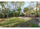 Private backyard with lush greenery and a fire pit area, perfect for relaxation at 314 Ontario Ave, Crystal Beach, FL 34681