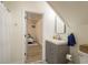 Small bathroom featuring a vanity with storage, and an open view into another room at 314 Ontario Ave, Crystal Beach, FL 34681