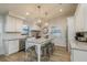 Bright kitchen boasts a marble island with seating, stainless steel appliances, and ample cabinet space at 314 Ontario Ave, Crystal Beach, FL 34681