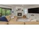 Inviting living room with fireplace and a screened-in porch providing a bright atmosphere at 314 Ontario Ave, Crystal Beach, FL 34681