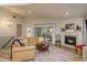 Cozy living room featuring a fireplace, comfortable seating, and natural light at 314 Ontario Ave, Crystal Beach, FL 34681