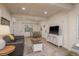 Open-concept living room with hardwood floors, dining area, comfortable seating, and media console at 314 Ontario Ave, Crystal Beach, FL 34681