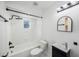 Modern bathroom featuring black fixtures, shower with tile, and a new vanity at 509 13Th Nw Ave, Largo, FL 33770