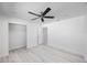 Bright bedroom featuring wood-look flooring, ceiling fan, and open closet at 509 13Th Nw Ave, Largo, FL 33770
