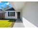 Close-up of the home's entrance, highlighting the walkway and front door at 509 13Th Nw Ave, Largo, FL 33770