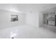 Bright and open living room featuring stylish white tile flooring and recessed lighting at 509 13Th Nw Ave, Largo, FL 33770