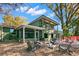 Inviting backyard featuring a fire pit, screened porch, and seating, ideal for outdoor gatherings at 550 7Th S St, Safety Harbor, FL 34695