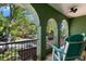 Covered balcony with scenic neighborhood views and comfortable seating at 550 7Th S St, Safety Harbor, FL 34695