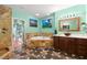 Luxurious bathroom features a standalone shower, jetted tub, and elegant stone finishes at 550 7Th S St, Safety Harbor, FL 34695