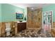 Well-lit bathroom with a standalone stone shower, modern vanity, and tasteful decor at 550 7Th S St, Safety Harbor, FL 34695