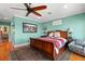 Comfortable bedroom featuring a plush bed, a cozy sitting chair, and elegant decor at 550 7Th S St, Safety Harbor, FL 34695