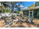 Cozy outdoor fire pit area with Adirondack chairs, perfect for entertaining and enjoying evenings outdoors at 550 7Th S St, Safety Harbor, FL 34695