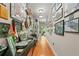 Hallway decorated with a variety of framed artwork and displayed items at 550 7Th S St, Safety Harbor, FL 34695