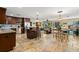 Spacious kitchen with dark cabinets, stainless steel appliances, large center island, and an open floor plan at 550 7Th S St, Safety Harbor, FL 34695
