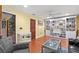 Inviting living room featuring hardwood floors, custom built-in shelving, and a cozy seating area at 550 7Th S St, Safety Harbor, FL 34695