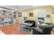 Cozy living room featuring hardwood floors, built-in shelves, and comfortable seating at 550 7Th S St, Safety Harbor, FL 34695