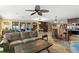 Open-concept living room with a kitchen bar and comfortable seating arrangement at 550 7Th S St, Safety Harbor, FL 34695