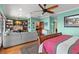 Main bedroom featuring a built-in desk area, a comfortable seating area, and stylish decor at 550 7Th S St, Safety Harbor, FL 34695
