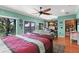 Stylish main bedroom offering a waterfront view, a comfortable sitting area, and ample natural light at 550 7Th S St, Safety Harbor, FL 34695