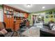 Office with custom wood built-ins, and an adjacent living room area at 550 7Th S St, Safety Harbor, FL 34695
