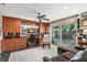 Home office featuring custom wood built-ins, a desk, and sliding glass doors to the outside at 550 7Th S St, Safety Harbor, FL 34695