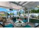 Screened patio with comfortable seating and scenic waterfront views at 550 7Th S St, Safety Harbor, FL 34695