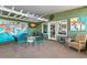Covered patio area with comfortable seating and artistic decor at 550 7Th S St, Safety Harbor, FL 34695