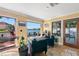 Bright sitting area featuring water views, comfortable chairs, and tiled floors at 550 7Th S St, Safety Harbor, FL 34695