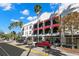 Charming street view showcasing buildings with red awnings and palm trees, creating a vibrant urban setting at 550 7Th S St, Safety Harbor, FL 34695