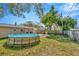 Fenced backyard with above ground pool and ample grassy area at 5632 62Nd N St, St Petersburg, FL 33709