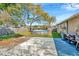 Backyard showcasing an above ground pool and a partial fence with clear blue skies at 5632 62Nd N St, St Petersburg, FL 33709