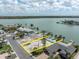 An aerial view showing the lot's location with a canal in a waterfront community at 575 Crystal Dr, Madeira Beach, FL 33708