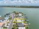 Aerial view showcasing the lot's location in a waterfront community, with canal access and proximity to the bay at 575 Crystal Dr, Madeira Beach, FL 33708