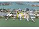 Aerial view showcases a lot with a pool and dock in a waterfront neighborhood at 575 Crystal Dr, Madeira Beach, FL 33708